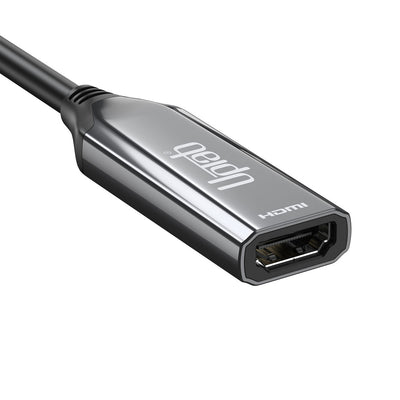 Close-up of UPTab USB-C to HDMI 2.1 HDR Active Adapter Rev 3 showing USB-C and HDMI 2.1 ports for seamless connectivity to monitors and TVs.